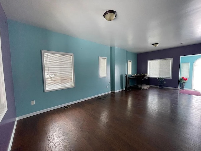 8056 Fisher Ave, Warren, MI 48089 - unfurnished living room featuring wood finished floors and baseboards