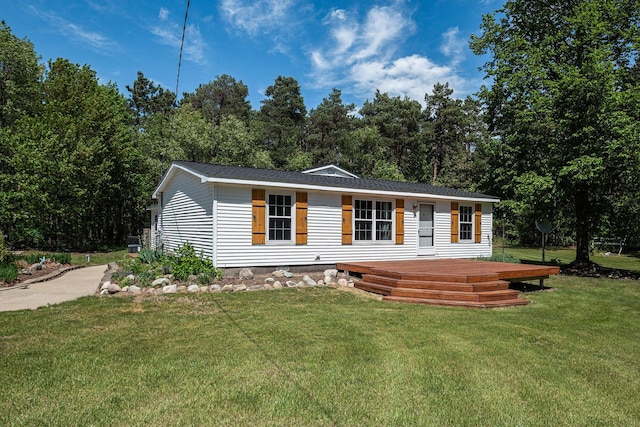 4171 E 124th St, Grant, MI 49327 - view of front facade featuring a front yard and a wooden deck
