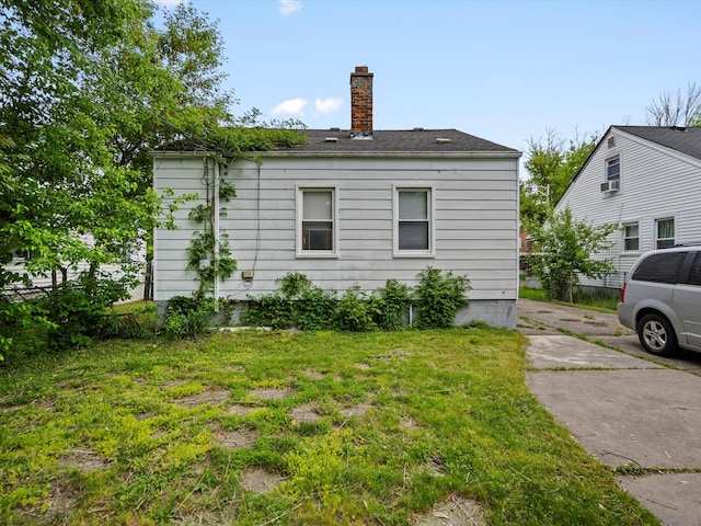 18914 Elkhart, Harper Woods, MI 48225 - view of side of property with a chimney and a yard