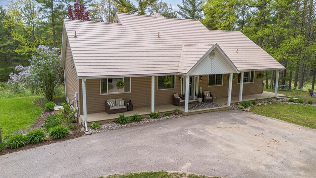 5511 Westside Dr, Alger, MI 48610 - back of property with a porch