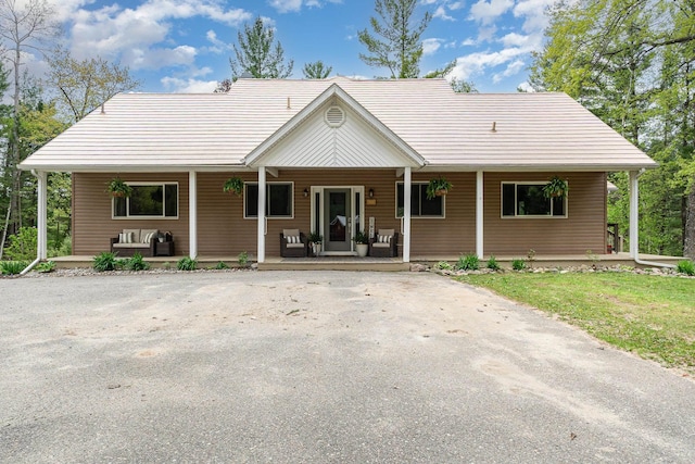 5511 Westside Dr, Alger, MI 48610 - view of front of home featuring covered porch