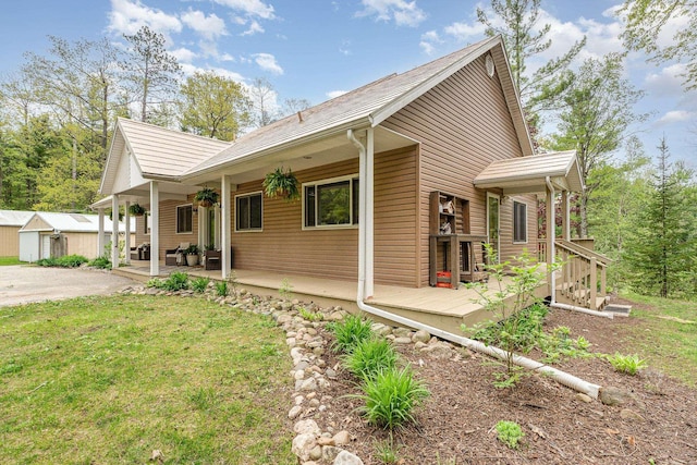 5511 Westside Dr, Alger, MI 48610 - view of side of property with covered porch