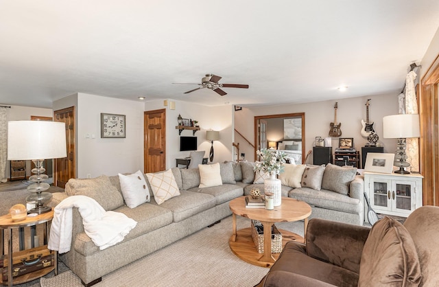 5511 Westside Dr, Alger, MI 48610 - living area featuring a ceiling fan and stairway