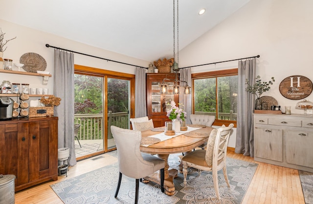 5511 Westside Dr, Alger, MI 48610 - dining space with light wood finished floors, healthy amount of natural light, high vaulted ceiling, and recessed lighting