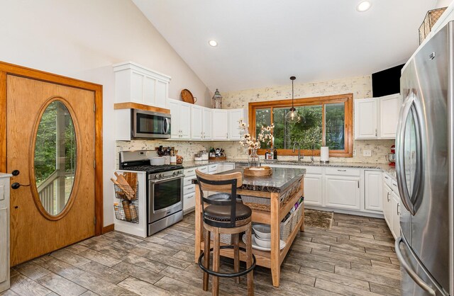 5511 Westside Dr, Alger, MI 48610 - kitchen with stainless steel appliances, healthy amount of natural light, decorative backsplash, a sink, and recessed lighting