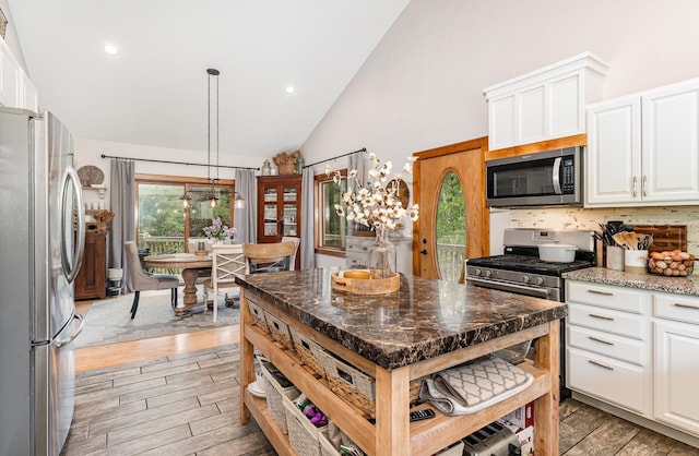 5511 Westside Dr, Alger, MI 48610 - kitchen featuring stainless steel appliances, white cabinetry, light wood finished floors, pendant lighting, and recessed lighting
