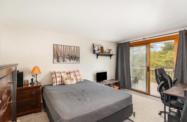 5511 Westside Dr, Alger, MI 48610 - bedroom featuring light carpet, access to outside, and a desk