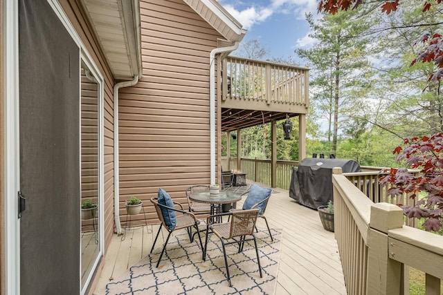 5511 Westside Dr, Alger, MI 48610 - wooden deck featuring outdoor dining area and a grill