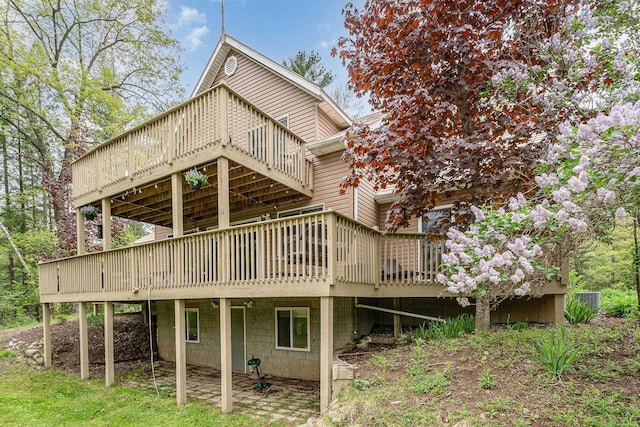 5511 Westside Dr, Alger, MI 48610 - back of house with a deck
