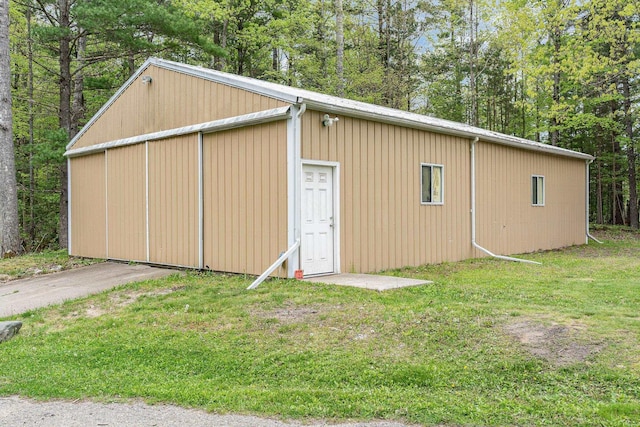 5511 Westside Dr, Alger, MI 48610 - view of pole building featuring a lawn and view of scattered trees