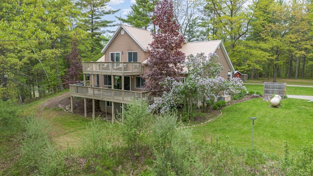 5511 Westside Dr, Alger, MI 48610 - back of property featuring a wooden deck and a lawn