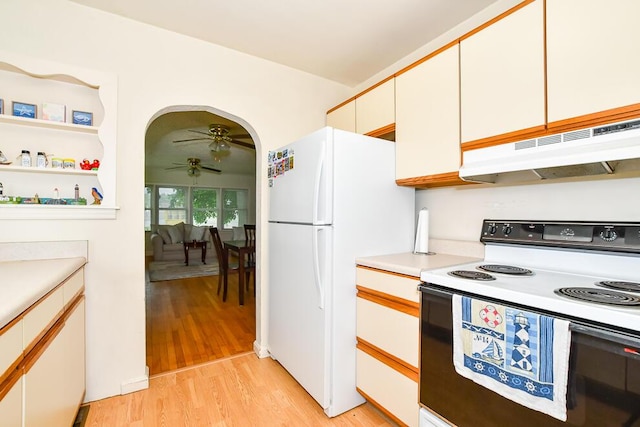 kitchen with white appliances, under cabinet range hood, a ceiling fan, light wood-type flooring, and light countertops