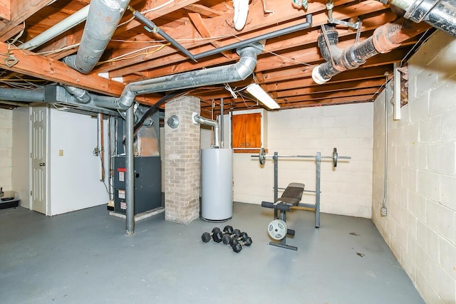 unfinished basement featuring gas water heater, heating unit, and concrete block wall