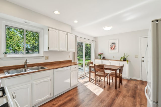 2761 Deake Ave, Ann Arbor, MI 48108 - kitchen featuring white appliances, a sink, white cabinetry, dark wood-style flooring, and recessed lighting