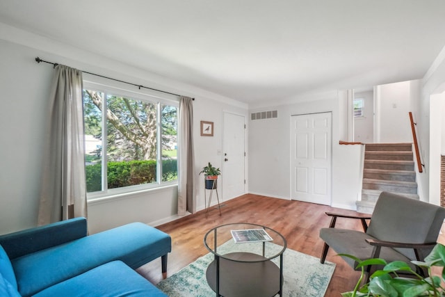 2761 Deake Ave, Ann Arbor, MI 48108 - living room with stairway, baseboards, and wood finished floors