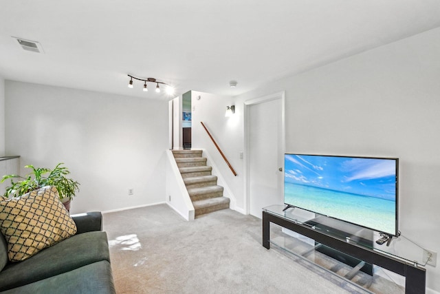 2761 Deake Ave, Ann Arbor, MI 48108 - carpeted living room with stairs and baseboards