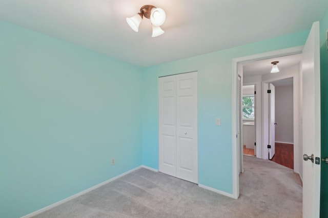 2761 Deake Ave, Ann Arbor, MI 48108 - unfurnished bedroom with light carpet, a closet, and baseboards