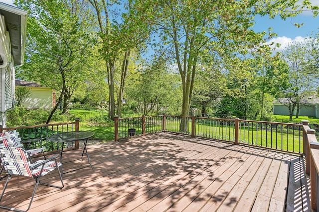 2761 Deake Ave, Ann Arbor, MI 48108 - wooden deck featuring a lawn and view of wooded area