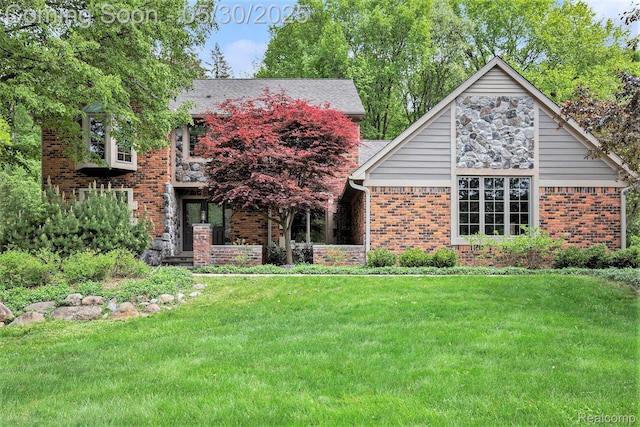 7254 Dark Lake Dr, Clarkston, MI 48346 - view of front of home with a front lawn and brick siding