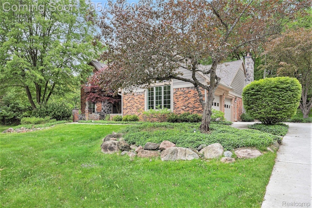 7254 Dark Lake Dr, Clarkston, MI 48346 - view of property hidden behind natural elements with brick siding, an attached garage, a front lawn, a chimney, and concrete driveway