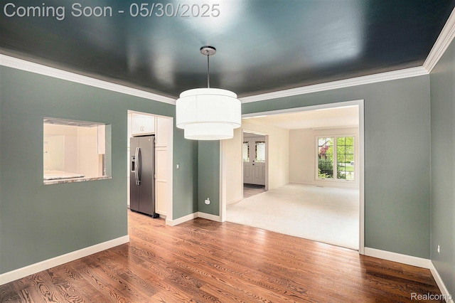 7254 Dark Lake Dr, Clarkston, MI 48346 - unfurnished room with crown molding, baseboards, and wood finished floors
