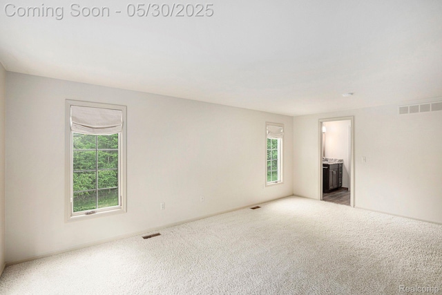7254 Dark Lake Dr, Clarkston, MI 48346 - unfurnished room featuring plenty of natural light, carpet floors, and baseboards
