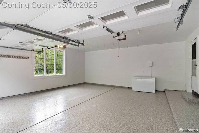 7254 Dark Lake Dr, Clarkston, MI 48346 - garage featuring refrigerator, baseboards, and a garage door opener