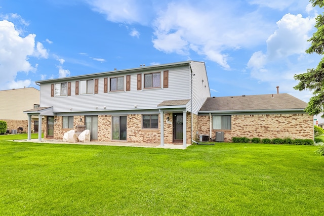 50102 S Angelo, Chesterfield, MI 48047 - rear view of property with brick siding, a lawn, a patio area, and central air condition unit