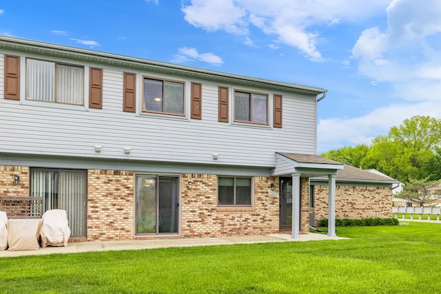 50102 S Angelo, Chesterfield, MI 48047 - rear view of property with brick siding and a lawn