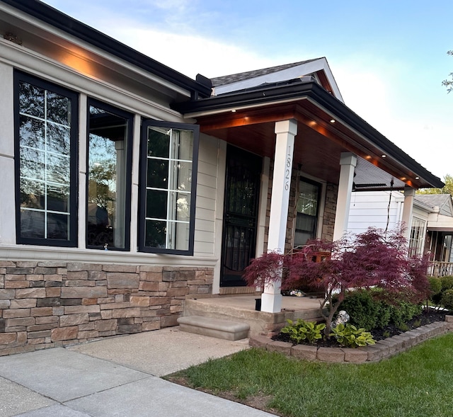1826 Morris Ave, Lincoln Park, MI 48146 - doorway to property with stone siding and a porch