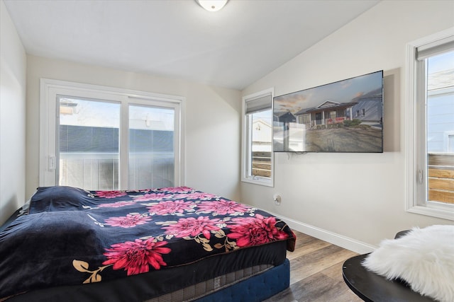 1826 Morris Ave, Lincoln Park, MI 48146 - bedroom featuring multiple windows, wood finished floors, lofted ceiling, and baseboards