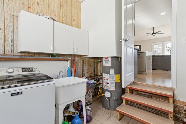 1826 Morris Ave, Lincoln Park, MI 48146 - washroom with washer / clothes dryer, gas water heater, cabinet space, a ceiling fan, and light tile patterned flooring