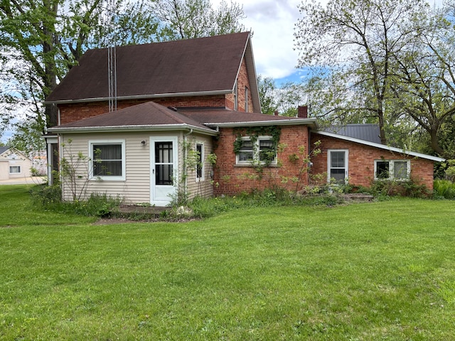 3927 W Sheldon Rd, Carsonville, MI 48419 - back of property with a yard and a chimney