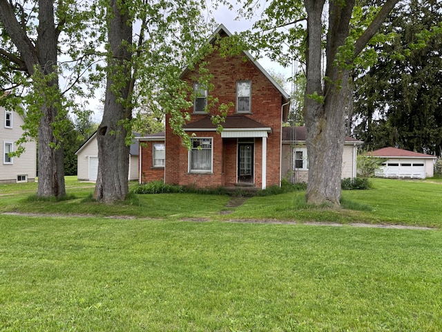 3927 W Sheldon Rd, Carsonville, MI 48419 - traditional-style home with a garage, a front lawn, and brick siding