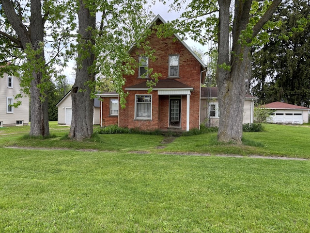 3927 W Sheldon Rd, Carsonville, MI 48419 - traditional-style home featuring a garage, a front lawn, and brick siding