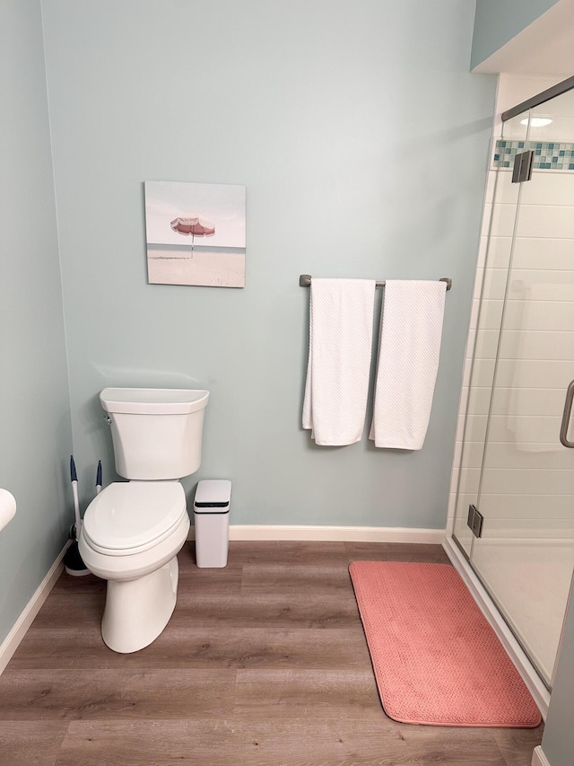 130 N Shore Dr Unit 8, South Haven, MI 49090 - full bath with a stall shower, wood finished floors, toilet, and baseboards