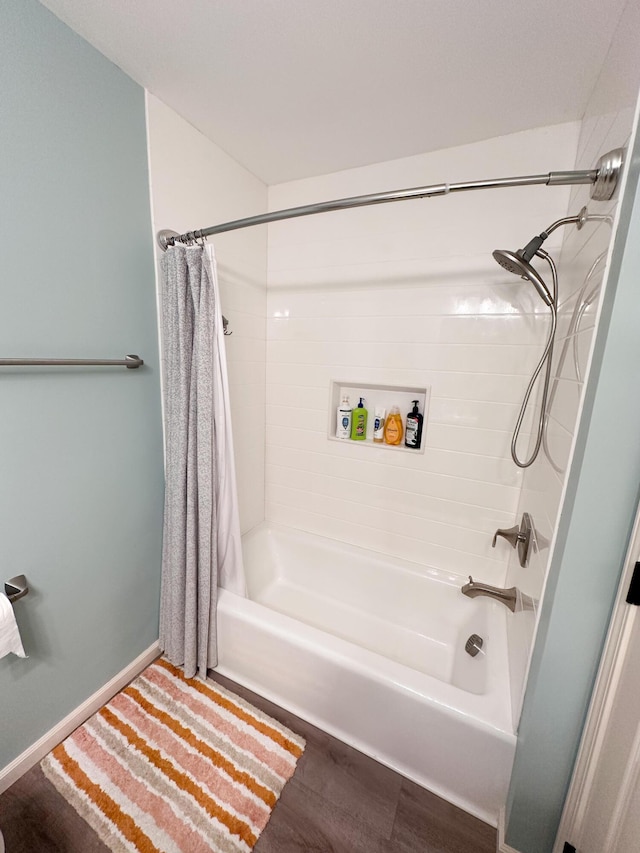 130 N Shore Dr Unit 8, South Haven, MI 49090 - bathroom with shower / tub combo with curtain and wood finished floors