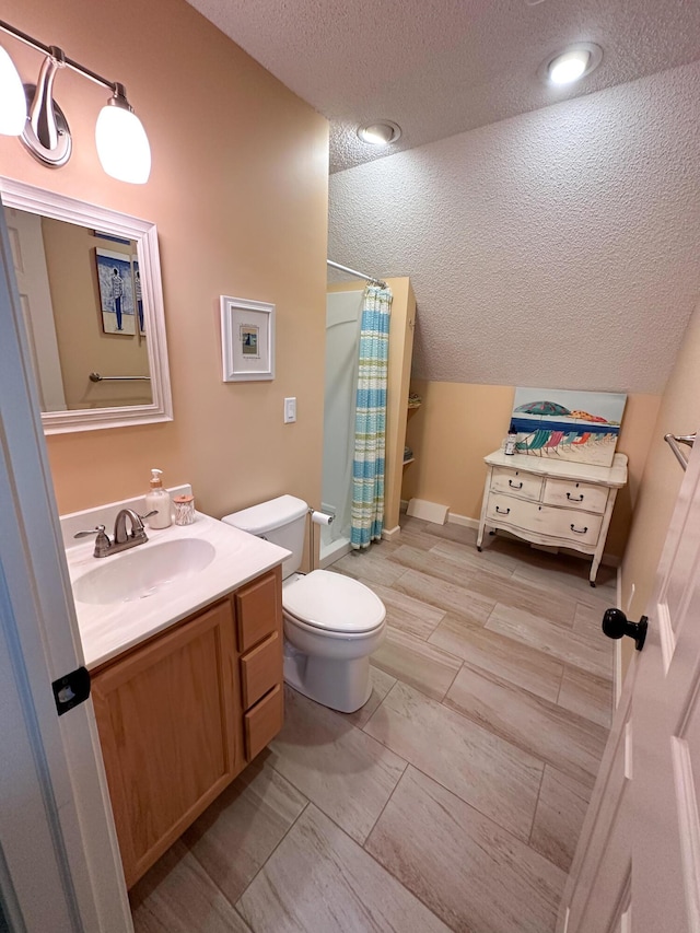 130 N Shore Dr Unit 8, South Haven, MI 49090 - bathroom featuring a textured ceiling, toilet, curtained shower, and vanity