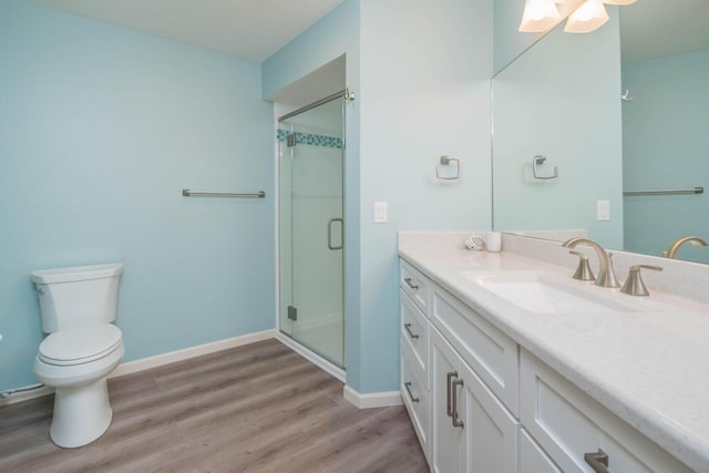 130 N Shore Dr Unit 8, South Haven, MI 49090 - full bath with wood finished floors, a stall shower, vanity, toilet, and baseboards