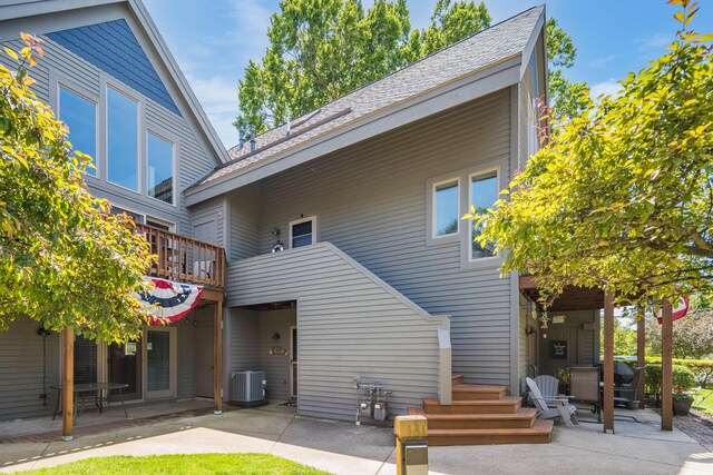 130 N Shore Dr Unit 8, South Haven, MI 49090 - rear view of property featuring cooling unit and a patio
