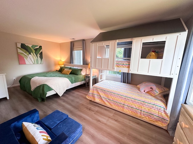 130 N Shore Dr Unit 8, South Haven, MI 49090 - bedroom featuring wood finished floors and baseboards