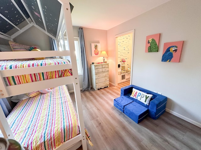 130 N Shore Dr Unit 8, South Haven, MI 49090 - bedroom featuring wood finished floors and baseboards