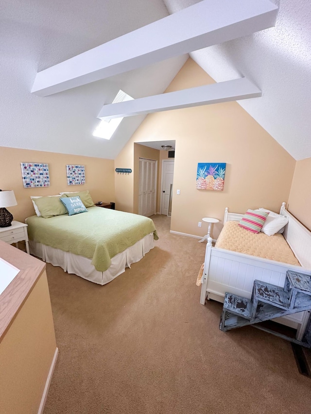 130 N Shore Dr Unit 8, South Haven, MI 49090 - bedroom featuring a skylight, light colored carpet, lofted ceiling, and baseboards