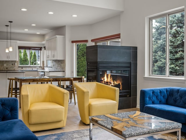 1231 Burns Dr, Troy, MI 48083 - living room with a glass covered fireplace and recessed lighting