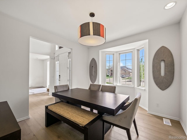 1231 Burns Dr, Troy, MI 48083 - dining area with baseboards, light wood-style flooring, and recessed lighting