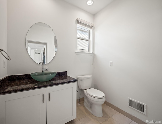 1231 Burns Dr, Troy, MI 48083 - bathroom featuring toilet, vanity, baseboards, and tile patterned floors