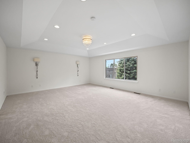 1231 Burns Dr, Troy, MI 48083 - unfurnished room with a tray ceiling, recessed lighting, carpet flooring, and baseboards