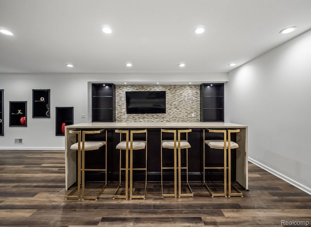 1231 Burns Dr, Troy, MI 48083 - indoor bar with dark wood-style floors, baseboards, recessed lighting, and decorative backsplash