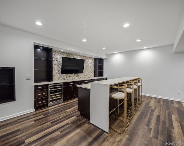 1231 Burns Dr, Troy, MI 48083 - indoor dry bar featuring wine cooler, dark wood-style floors, recessed lighting, backsplash, and baseboards