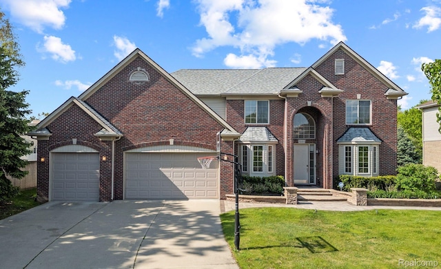 1231 Burns Dr, Troy, MI 48083 - traditional-style home with driveway, an attached garage, a front yard, and brick siding